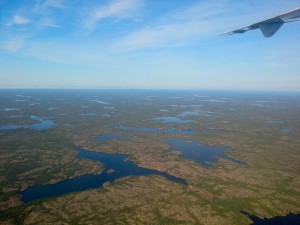 The view from the plane as we left Yellowknife. The area is starting to warm to the north. (Photo credit: John Kelly)