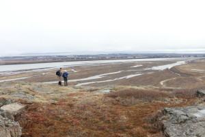 Researchers Greg Lehn and Rob Macdonald look out at the delta of the Coppermine River from the bluffs above. (Photo credit: John Kelly)