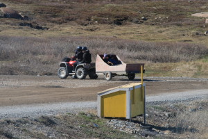 A family takes a trip around town on their quad with a trailer. (Photo credit: John Kelly)