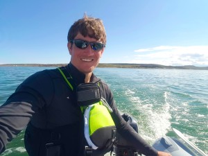 Driving the boat back to town after a great day of sampling - and seeing a seal! (Photo credit: John Kelly)